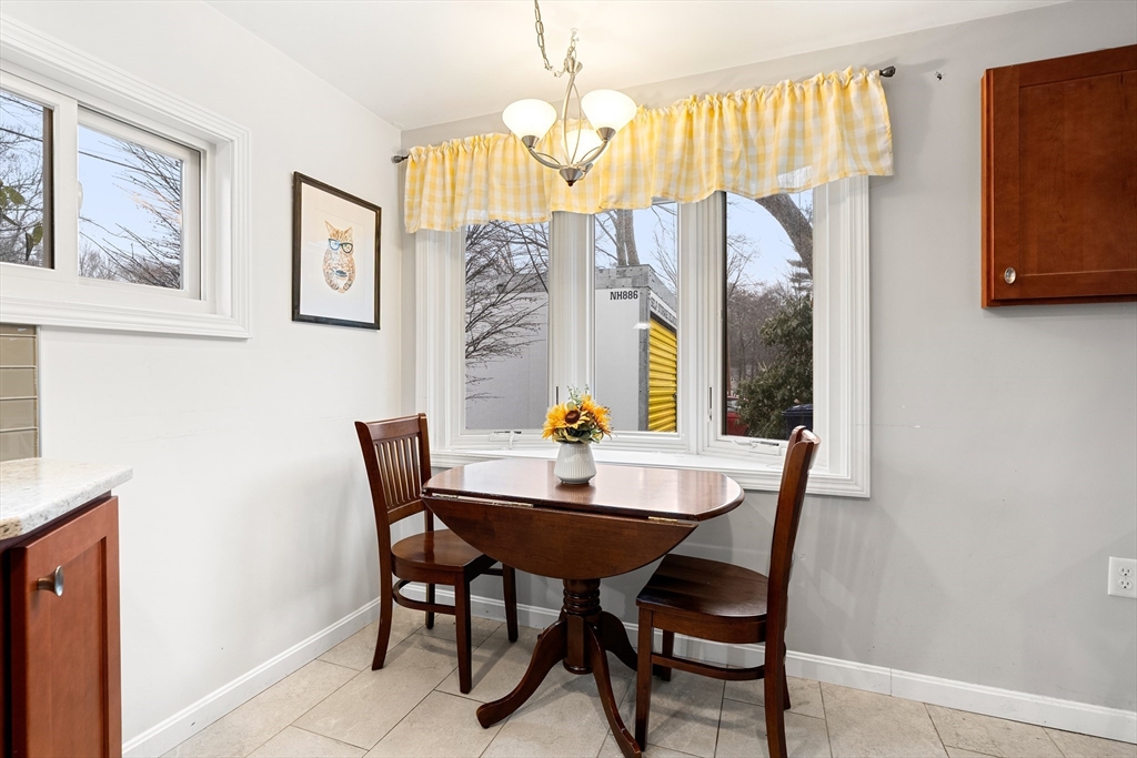 51 Winslow Road Reading, MA 01867 - Photo 11 of 40 a dining room with furniture and window