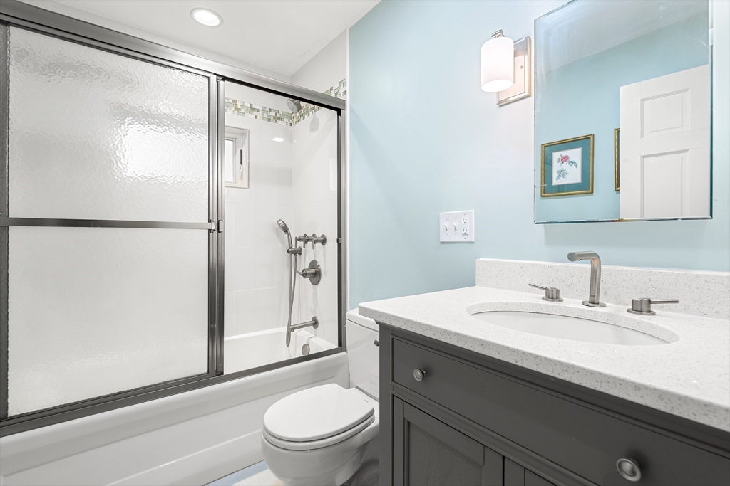 51 Winslow Road Reading, MA 01867 - Photo 12 of 40 a bathroom with a sink toilet and shower