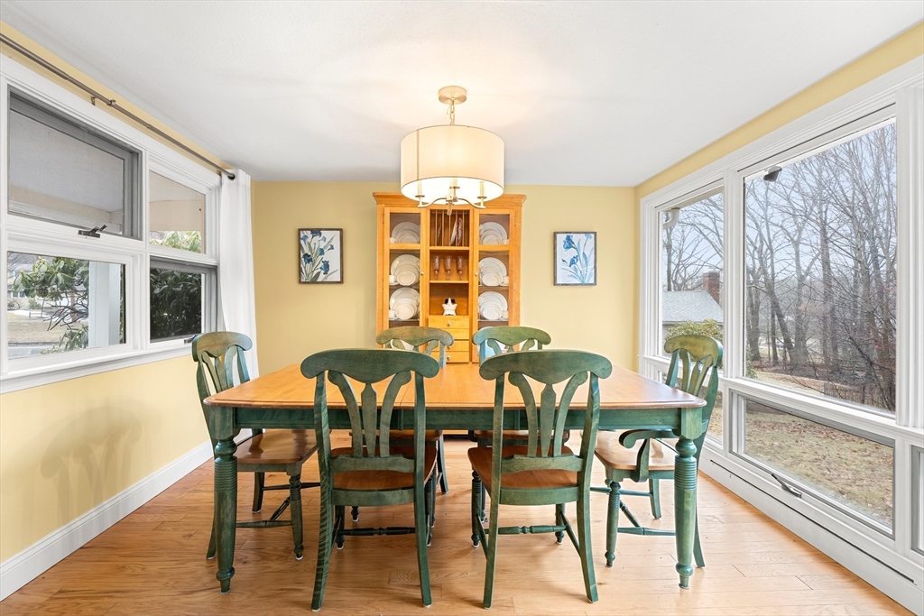51 Winslow Road Reading, MA 01867 - Photo 14 of 40 a view of a dining room with furniture large window and wooden floor