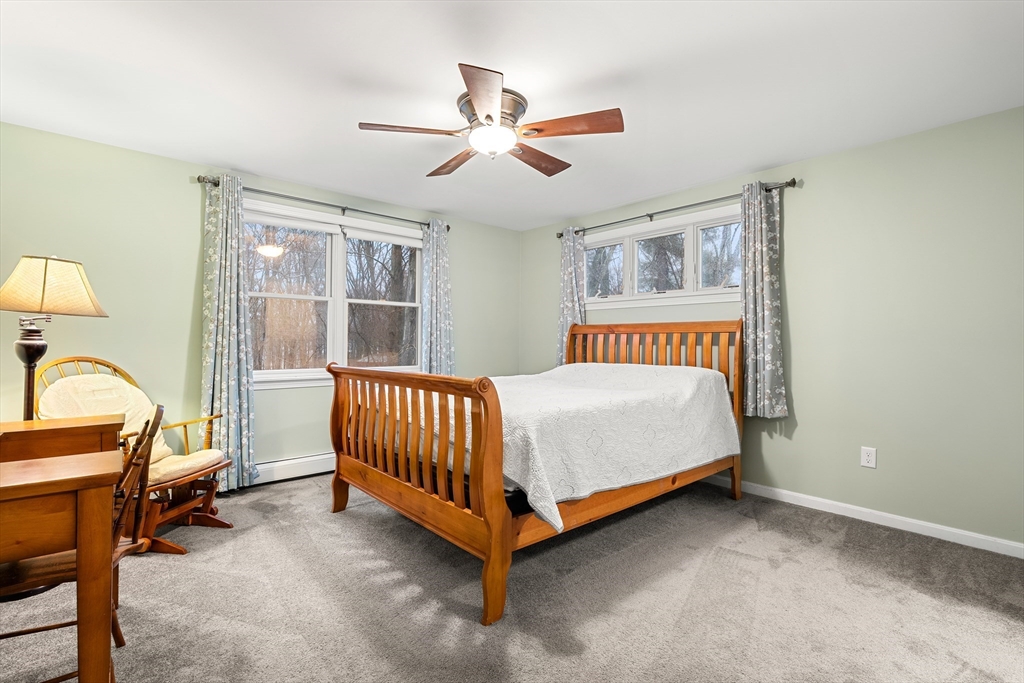 51 Winslow Road Reading, MA 01867 - Photo 18 of 40 a bed room with a bed and a window