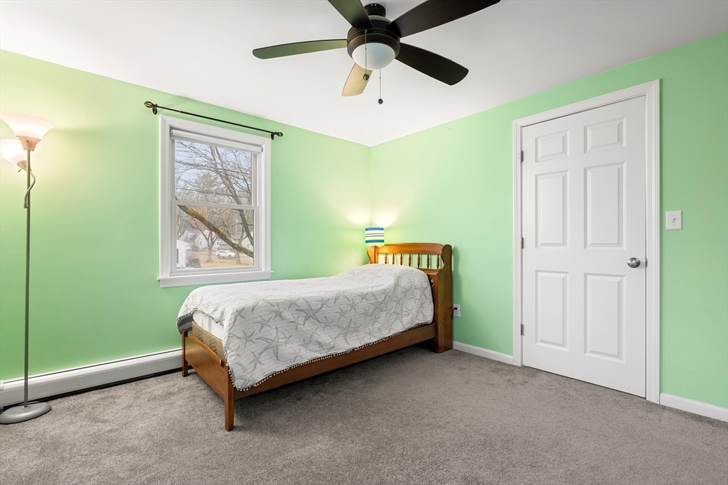 51 Winslow Road Reading, MA 01867 - Photo 20 of 40 a bedroom with a bed and a window