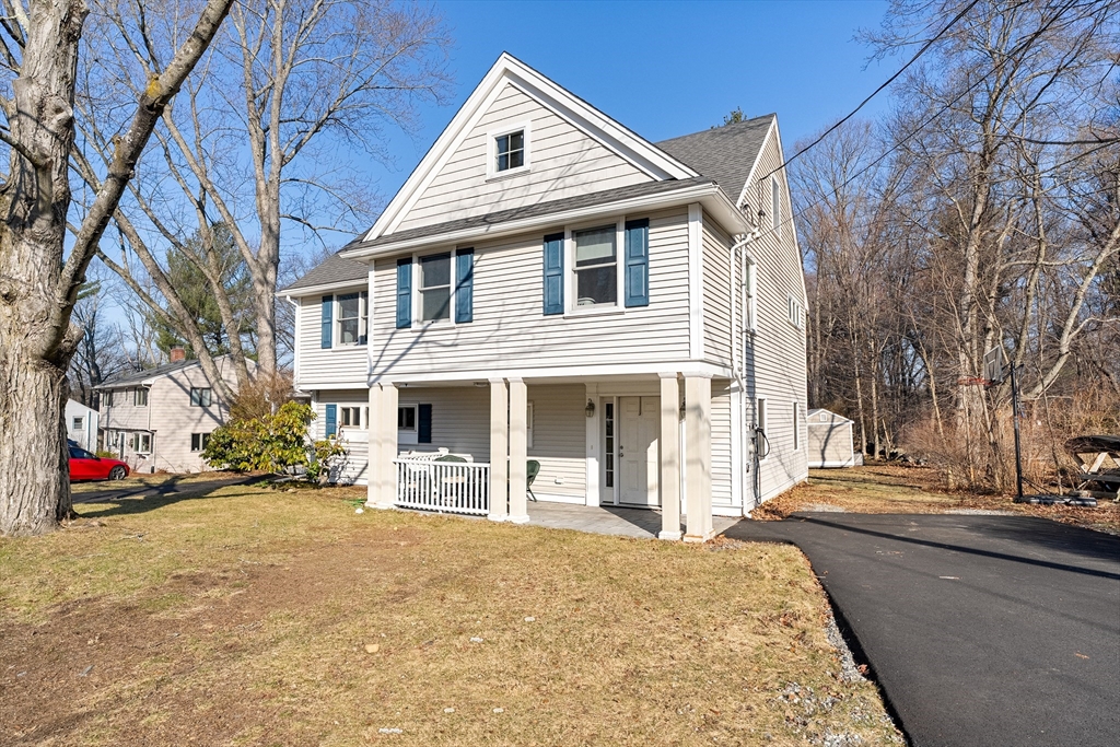 51 Winslow Road Reading, MA 01867 - Photo 2 of 40 a front view of a house with a yard