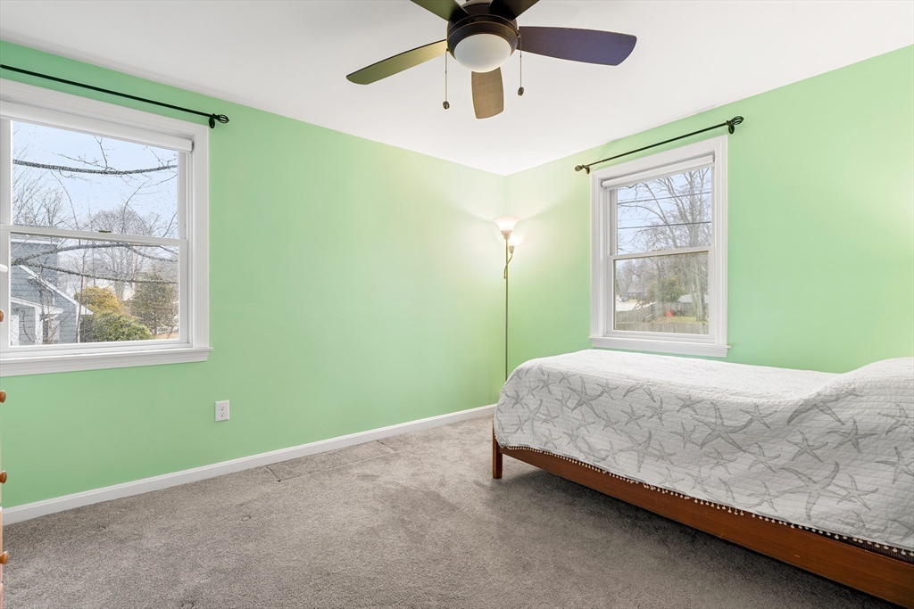 51 Winslow Road Reading, MA 01867 - Photo 21 of 40 a bedroom with a bed and window