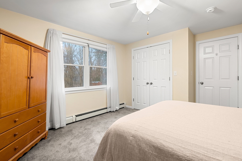 51 Winslow Road Reading, MA 01867 - Photo 23 of 40 a bedroom with a bed and a window