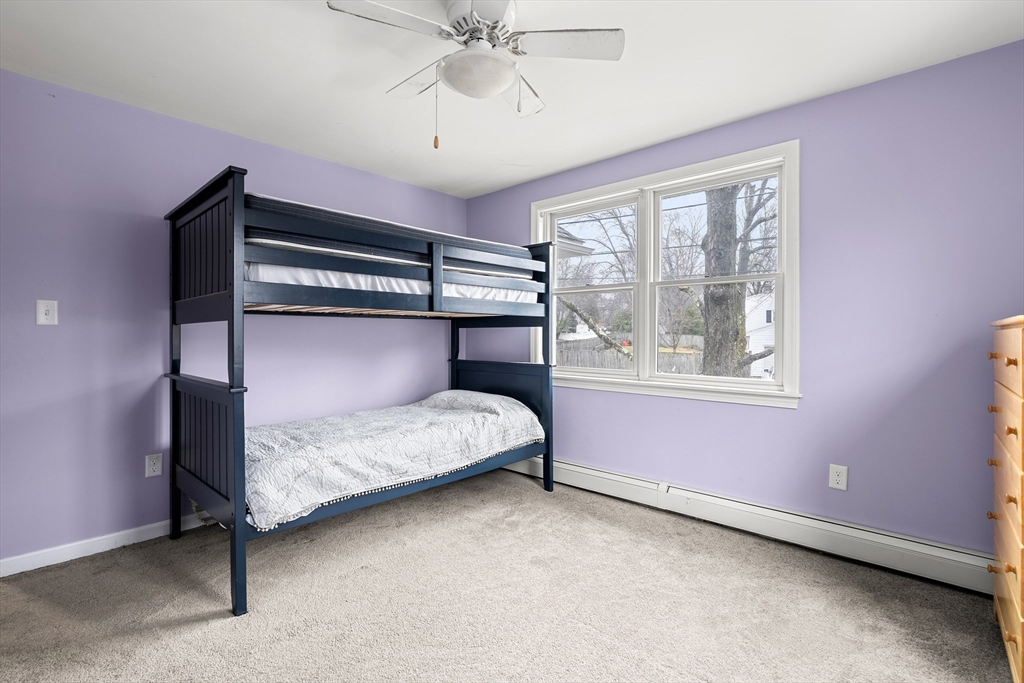 51 Winslow Road Reading, MA 01867 - Photo 24 of 40 a bedroom with a bed and window