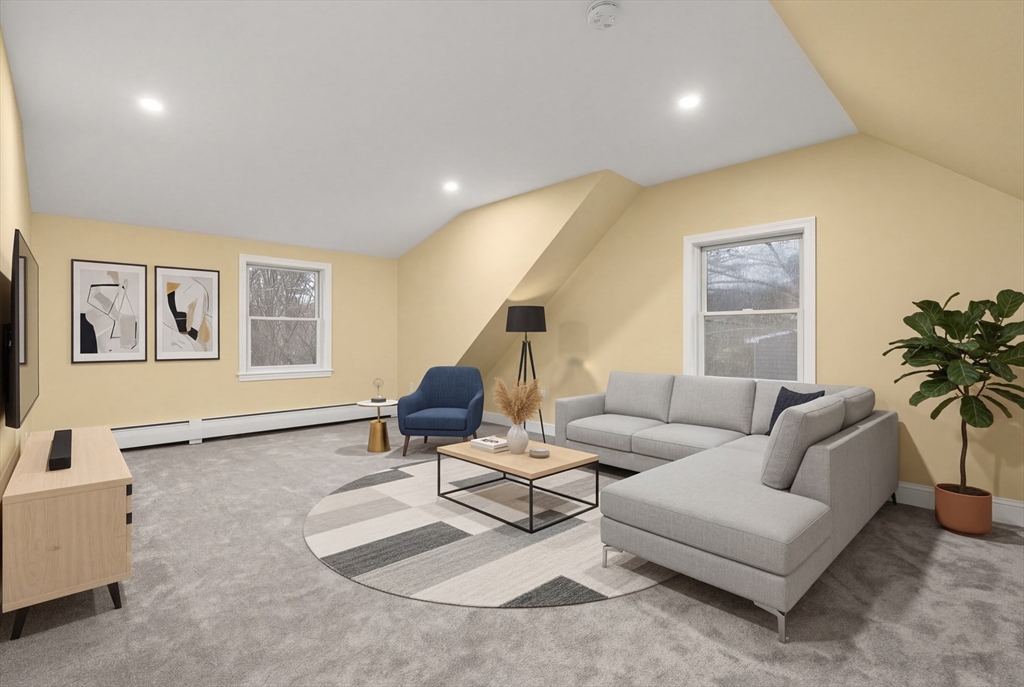 51 Winslow Road Reading, MA 01867 - Photo 29 of 40 a living room with furniture and a potted plant