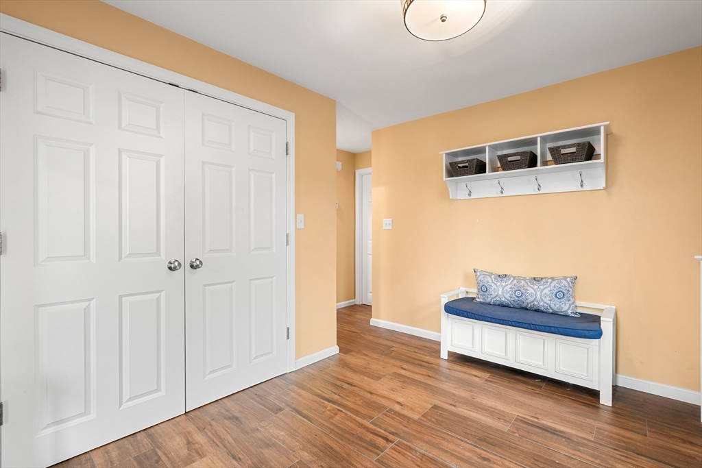 51 Winslow Road Reading, MA 01867 - Photo 5 of 40 a room with wooden floor and chair