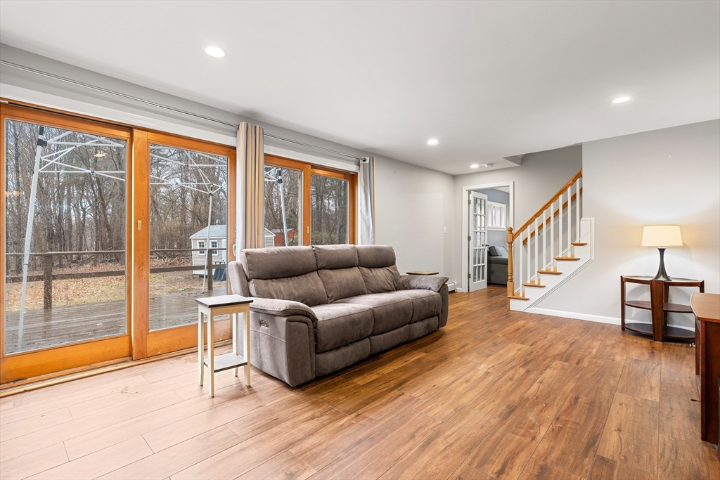 51 Winslow Road Reading, MA 01867 - Photo 7 of 40 a living room with furniture and a wooden floor