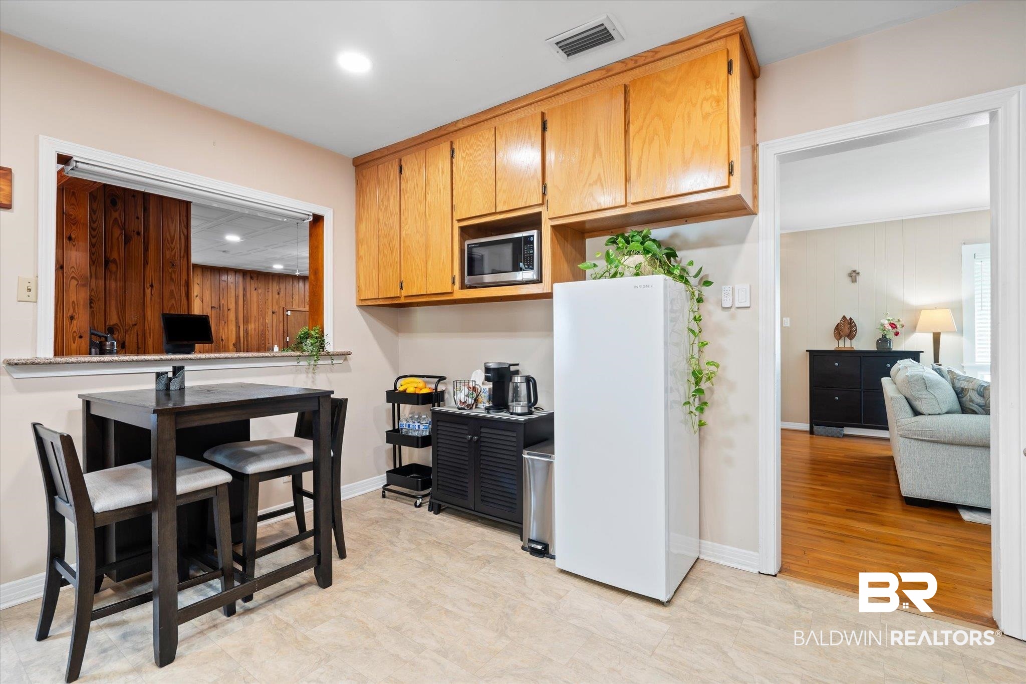 162 Bit And Spur Terrace Mobile, AL 36608 - Photo 7 of 29 Kitchen featuring light hardwood / wood-style flooring, white fridge, and stainless steel microwave