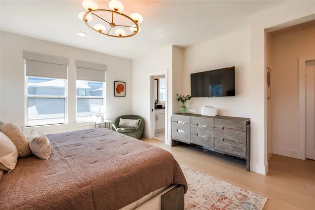 a spacious bedroom with a bed and a couch