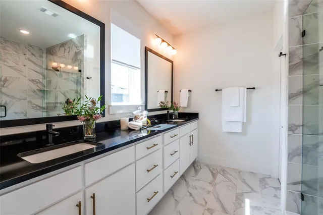 a bedroom with a bed and flat screen tv