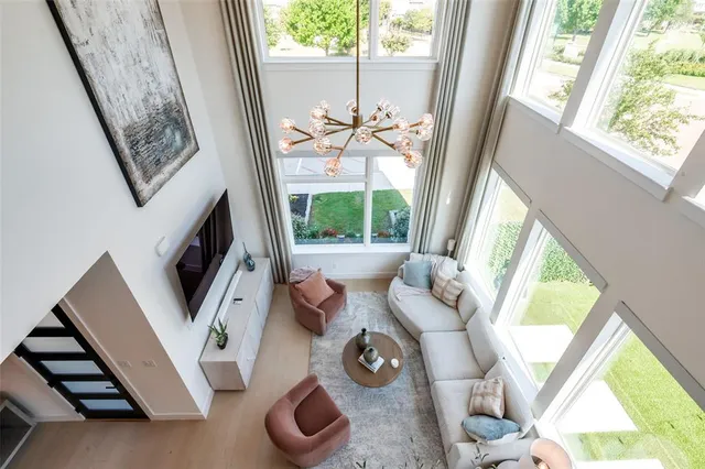 a room with pool table and windows