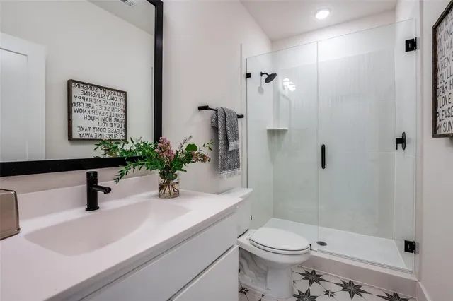 a bedroom with a bed couch and a window