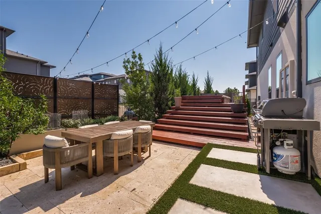 a view of a patio with couches chairs and a fire pit
