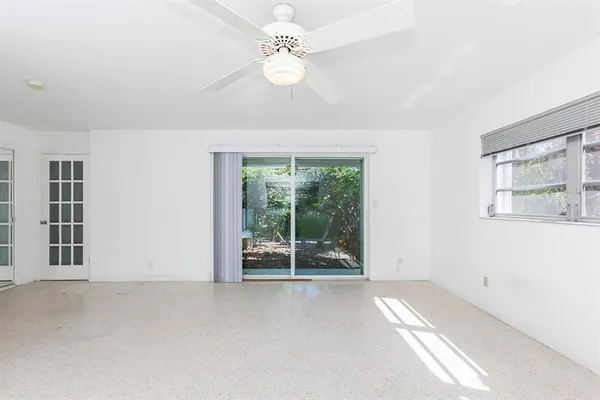 a view of an empty room with a window