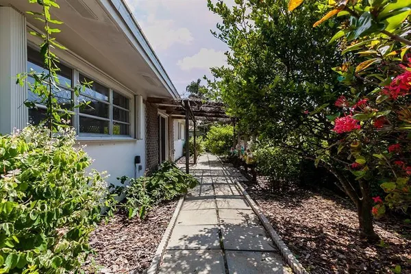 a view of path along with house and trees
