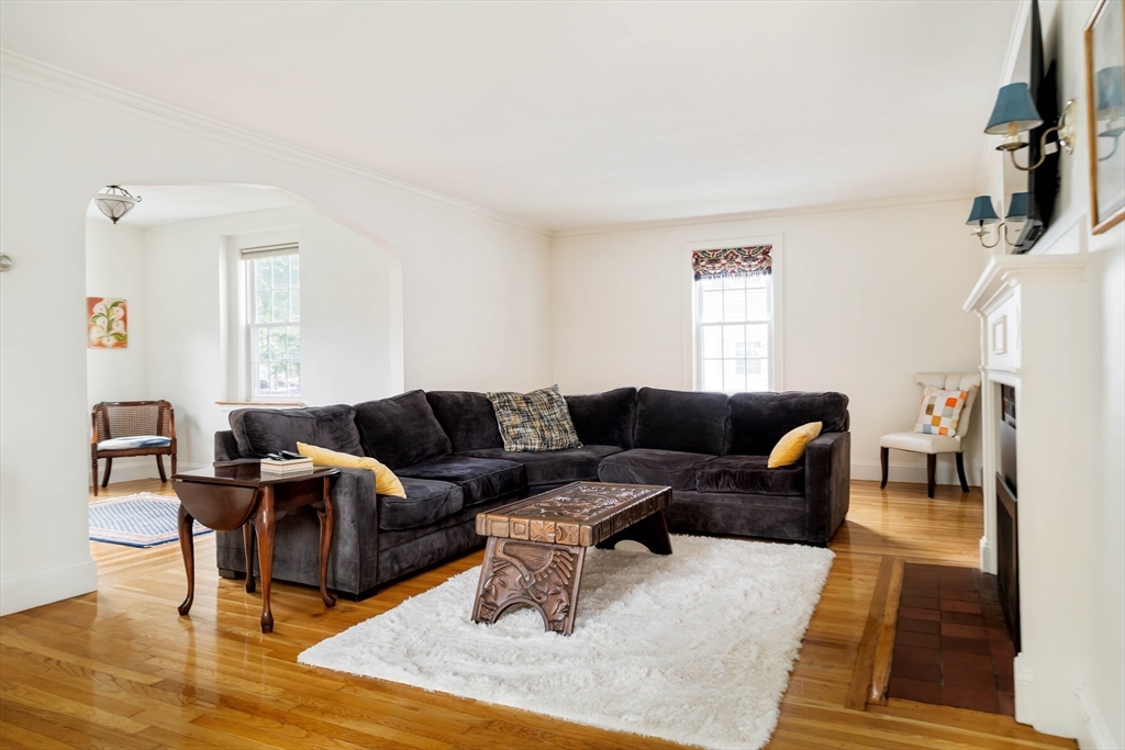 7 St Marys Road Milton, MA 02186 - Photo 2 of 31 a living room with furniture and a wooden floor