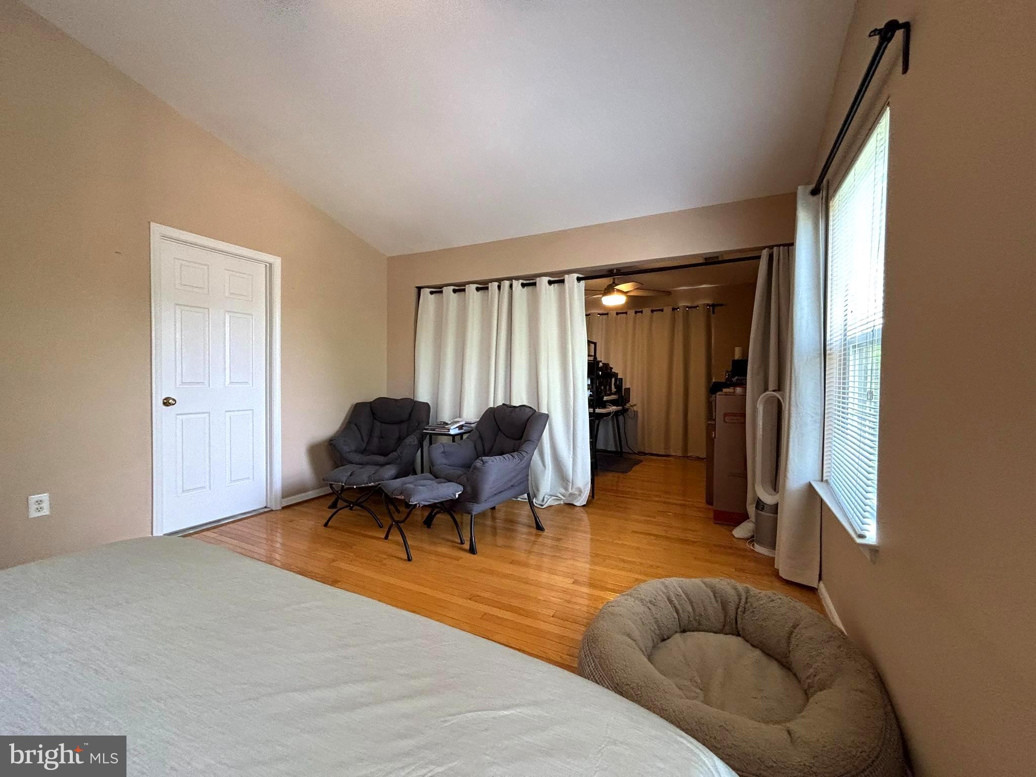 6659 Patent Parish Lane Alexandria, VA 22315 - Photo 15 of 16 a living room with furniture and a large window