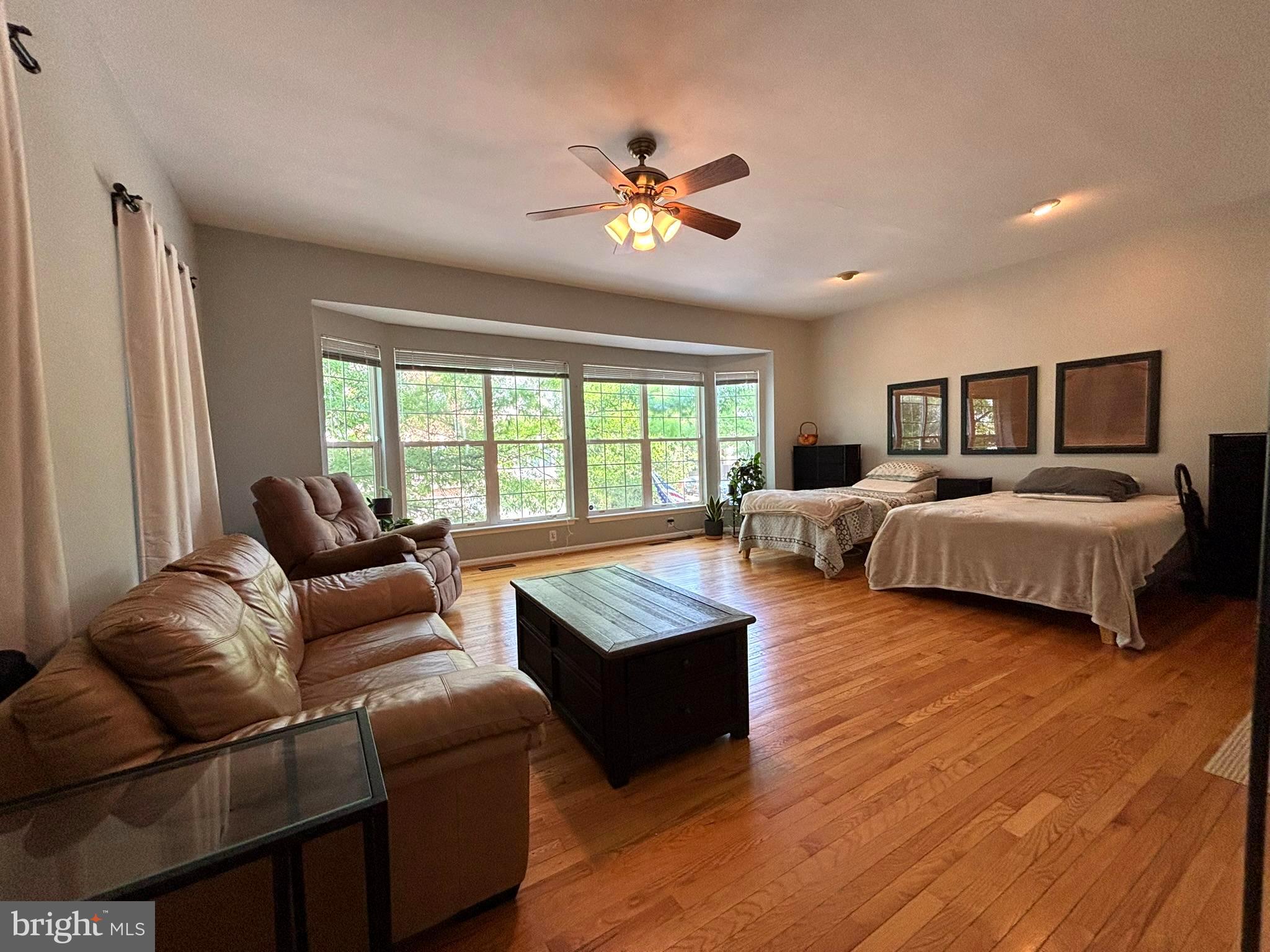 6659 Patent Parish Lane Alexandria, VA 22315 - Photo 3 of 16 a living room with furniture and a large window