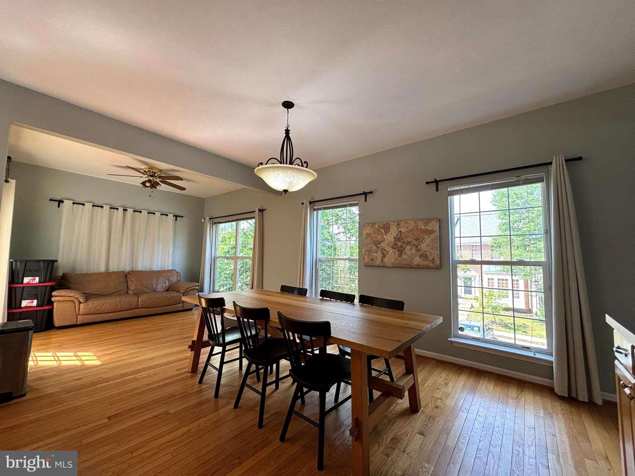 6659 Patent Parish Lane Alexandria, VA 22315 - Photo 5 of 16 a view of a a dining room with furniture window and wooden floor