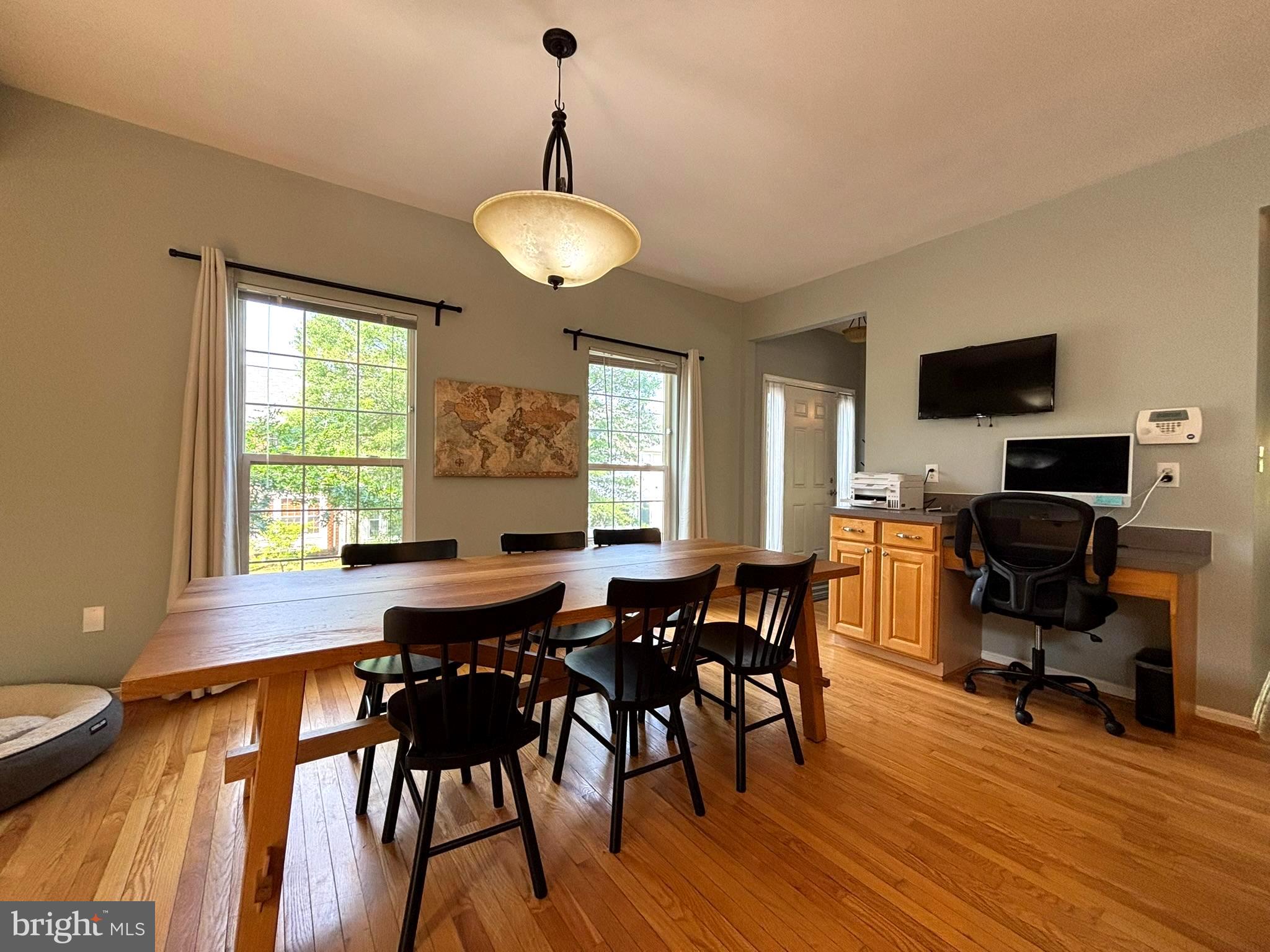 6659 Patent Parish Lane Alexandria, VA 22315 - Photo 6 of 16 a view of a dining room with furniture window and wooden floor