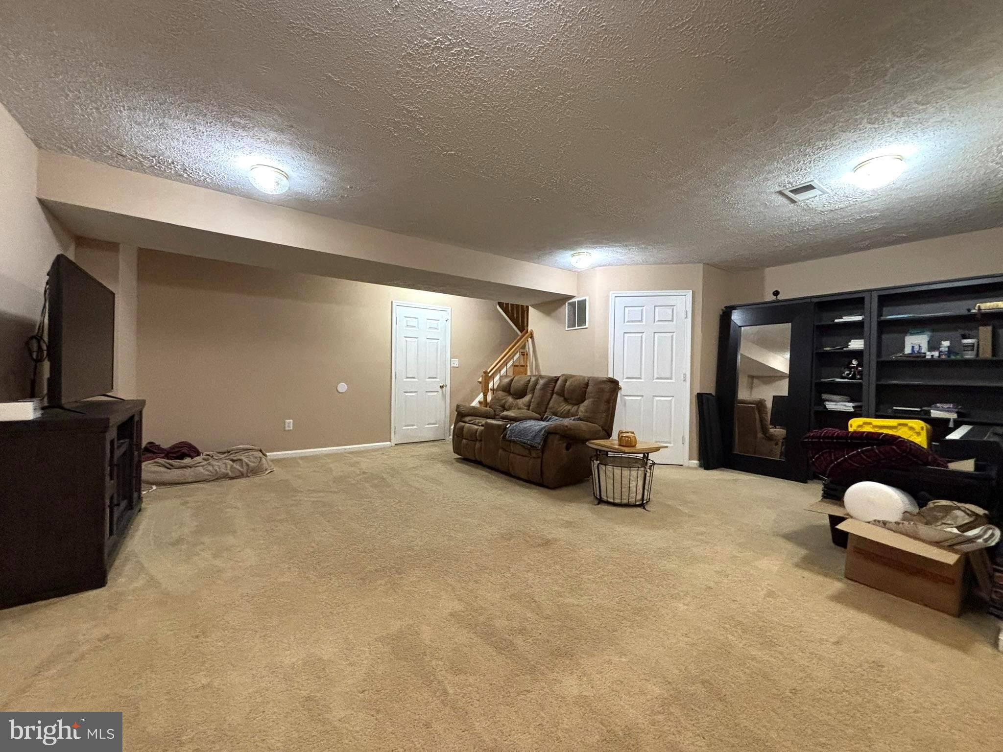6659 Patent Parish Lane Alexandria, VA 22315 - Photo 7 of 16 a bedroom with furniture and a lamp