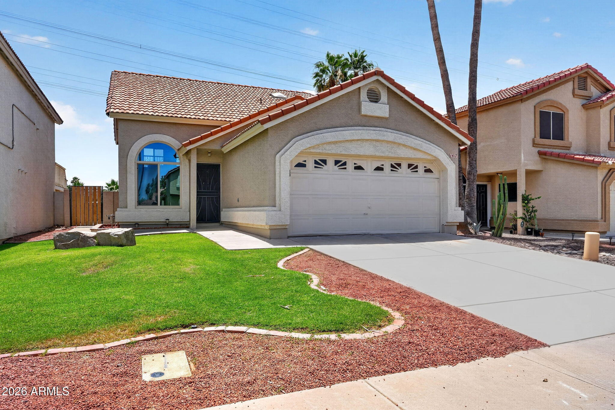 1417 East Mineral Road Gilbert, AZ 85234 - Photo 6 of 59 a front view of a house with a yard