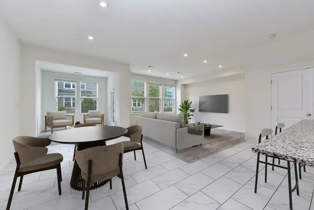 a dining room with furniture and window