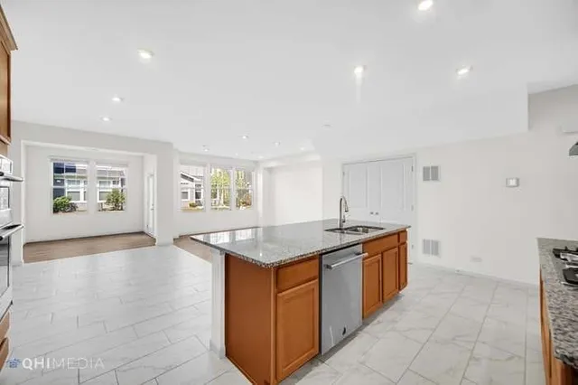 a kitchen that has a sink and a stove in it