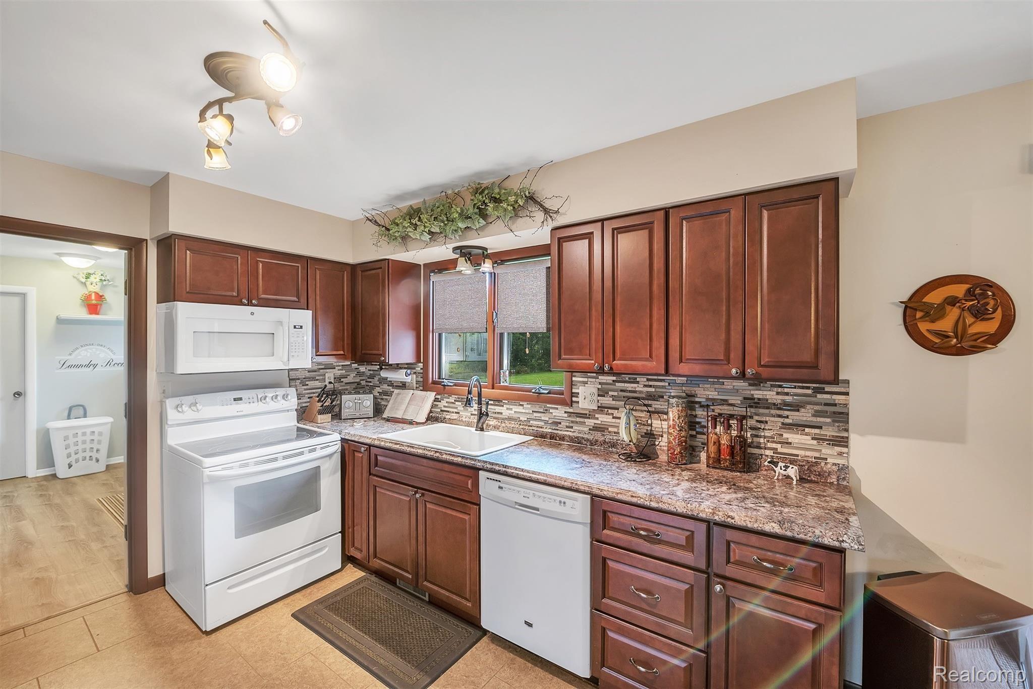 3876 Innisfree Road Howell, MI 48855 - Photo 10 of 31 Huge Laundry Room off Kitchen