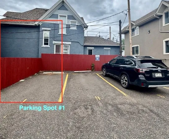 a view of a car park in front of house
