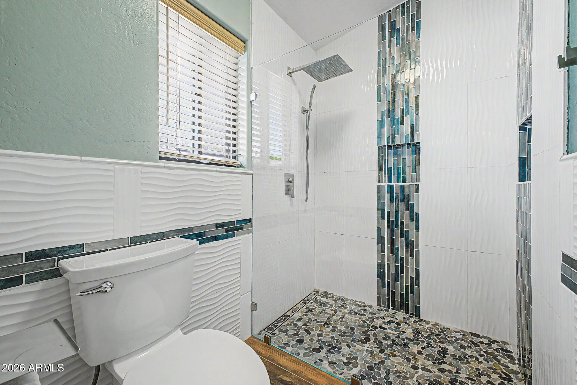 802 East Roberts Road Phoenix, AZ 85022 - Photo 12 of 24 a bathroom with a toilet and a shower