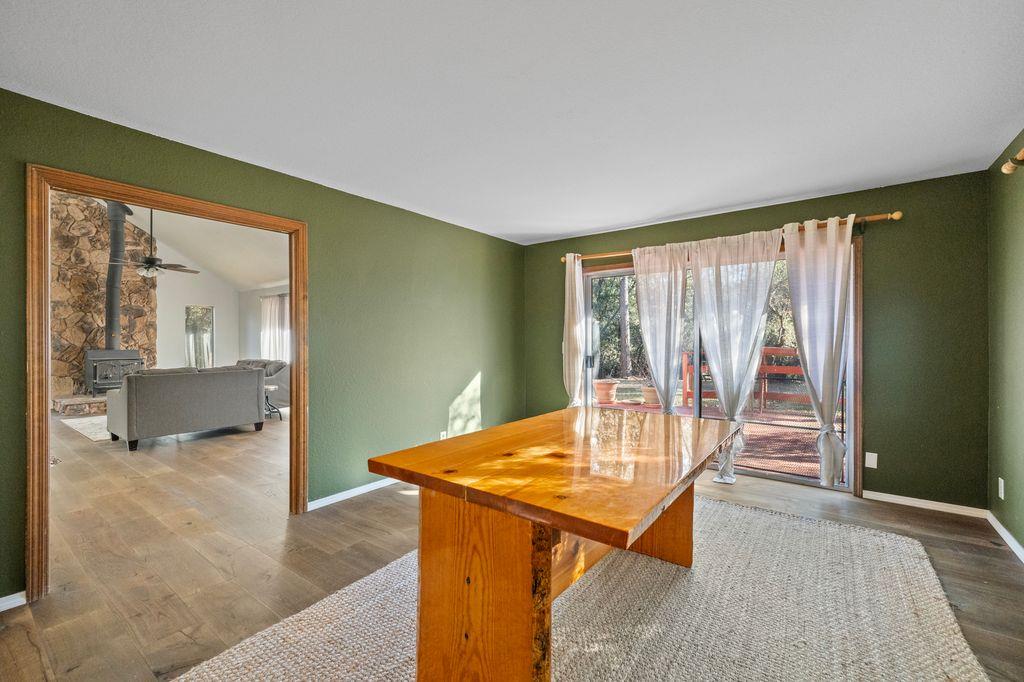 1480 Pennsylvania Gulch Road Murphys, CA 95247 - Photo 11 of 31 a view of a dining room with furniture and wooden floor