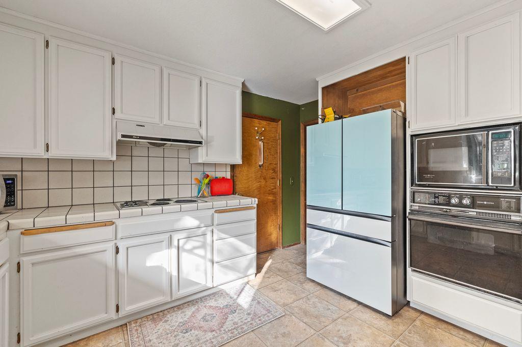 1480 Pennsylvania Gulch Road Murphys, CA 95247 - Photo 15 of 31 a kitchen with a refrigerator sink and cabinets