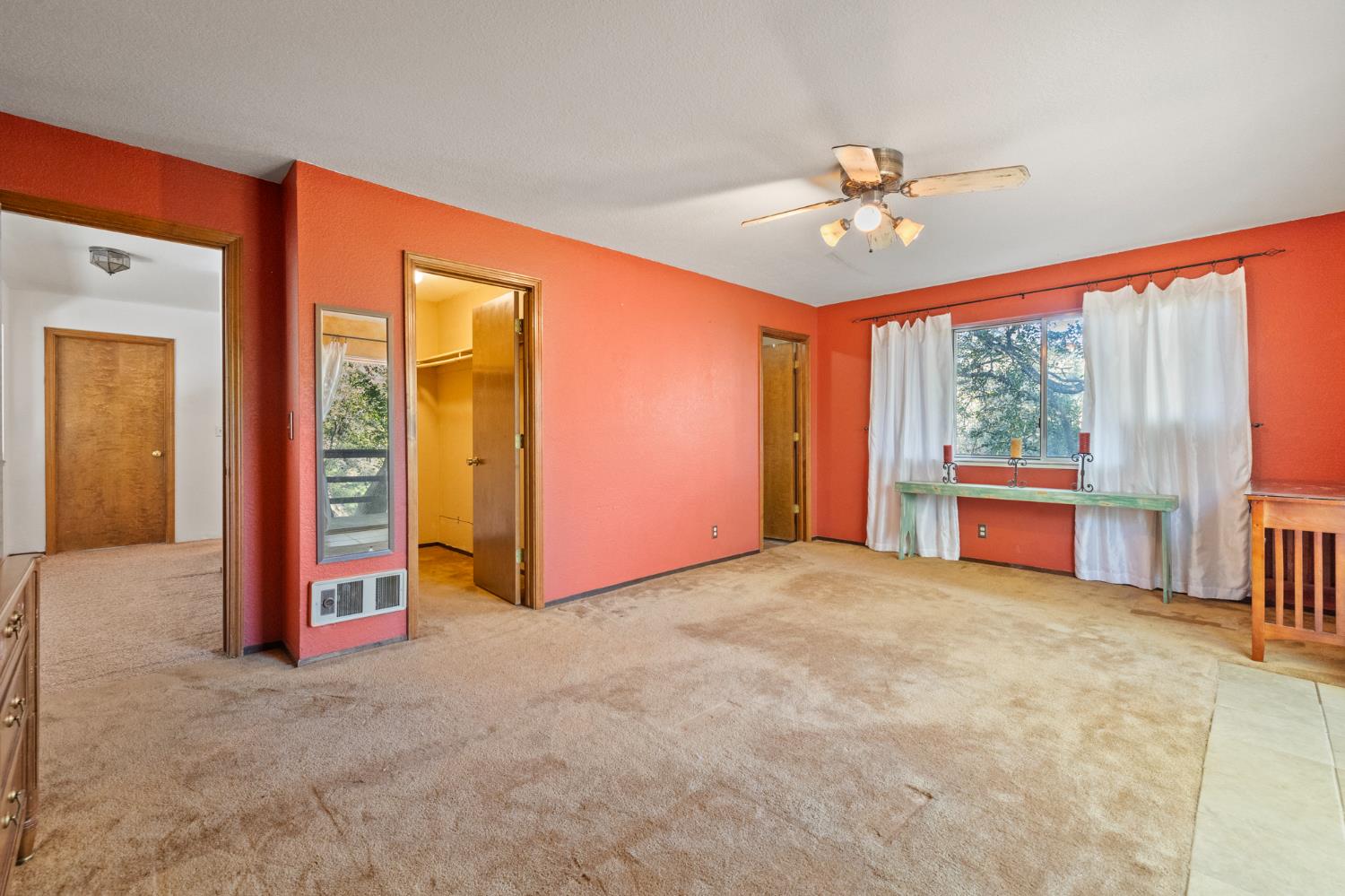 1480 Pennsylvania Gulch Road Murphys, CA 95247 - Photo 20 of 31 an empty room with chandelier fan and windows