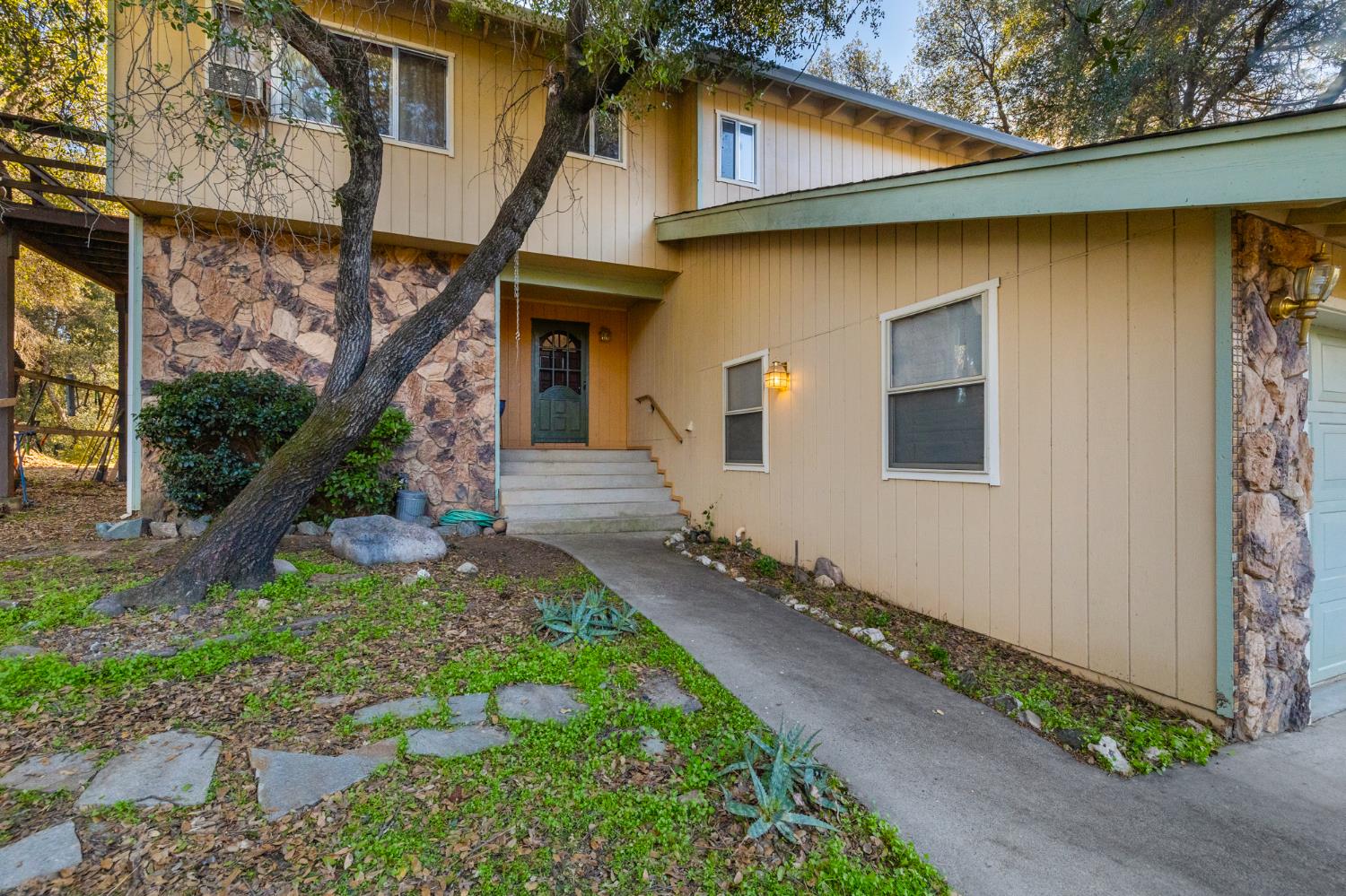 1480 Pennsylvania Gulch Road Murphys, CA 95247 - Photo 2 of 31 a front view of a house with garden