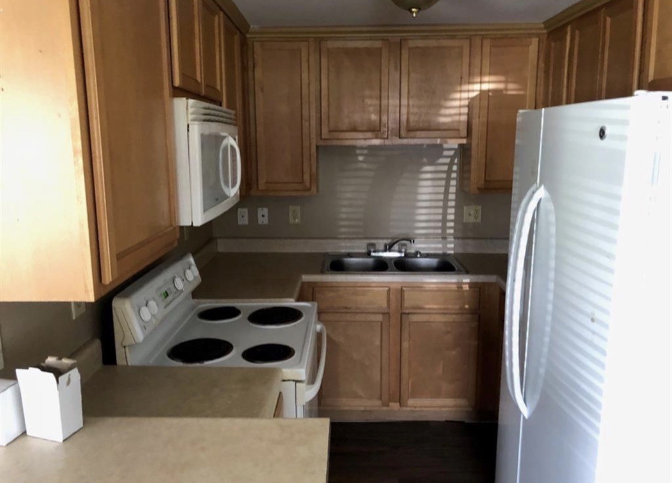 2308 10th Avenue La Marque, TX 77568 - Photo 5 of 8 a kitchen with a refrigerator and a stove