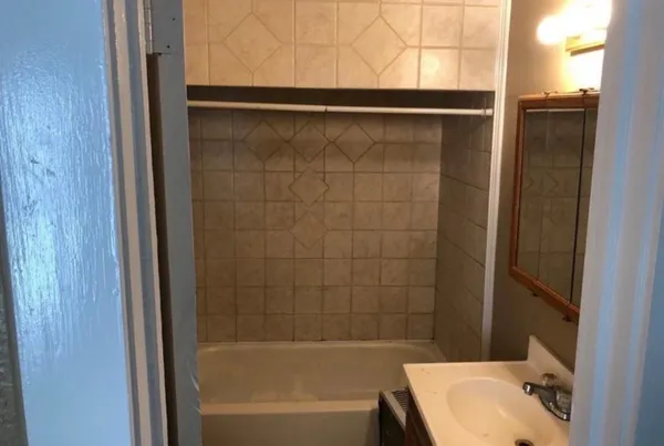 a bathroom with a bathtub and sink