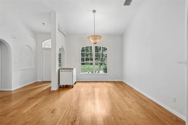 a view of a room with window wooden floor and outdoor space