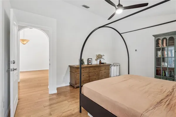 a bedroom with a bed and a table