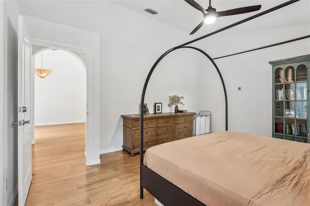 a bedroom with a bed and a table