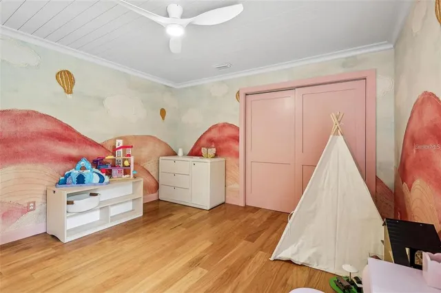 a view of a bedroom with baby crib