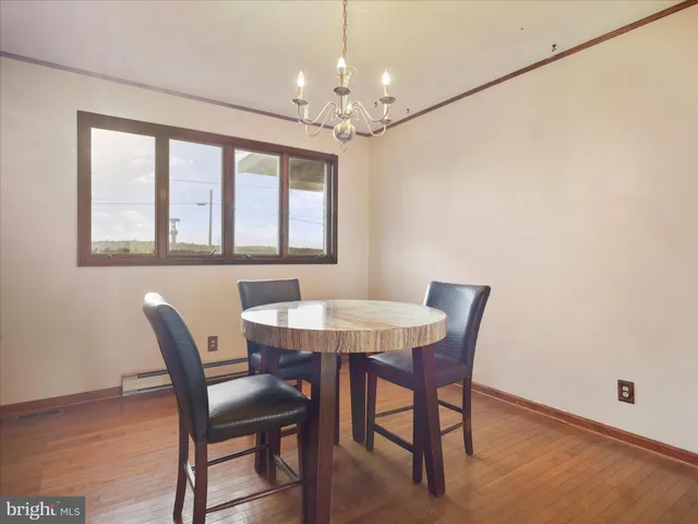 a bedroom with a bed a table and chair