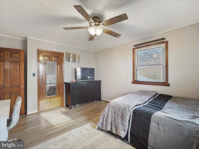 a bedroom with a bed and furniture