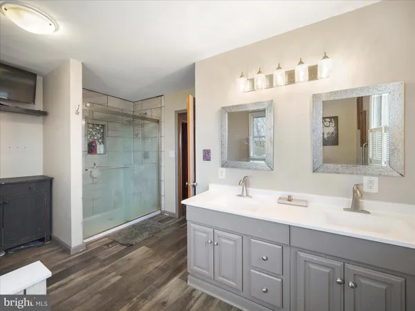 a bedroom with a bed and a mirror