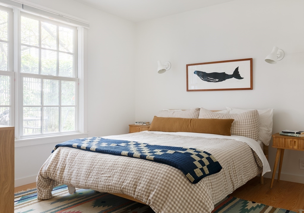 20 Brown Street Cambridge, MA 02138 - Photo 12 of 21 a bedroom with a bed and wooden floor