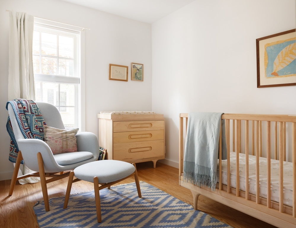 20 Brown Street Cambridge, MA 02138 - Photo 17 of 21 a living room with furniture a rug and a window