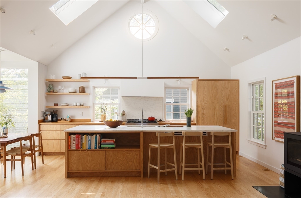 20 Brown Street Cambridge, MA 02138 - Photo 3 of 21 a dining room with furniture and a chandelier