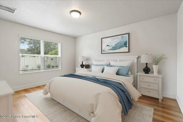 a bedroom with bed and window