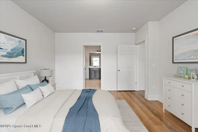 a bedroom with a bed and a couch